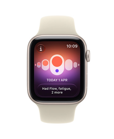 Apple Watch SE 3, aluminum case, starlight color, screen shows health tracking (cycle tracking), right side exterior, Digital Crown dial, Sport Band, sand color (pale tan)